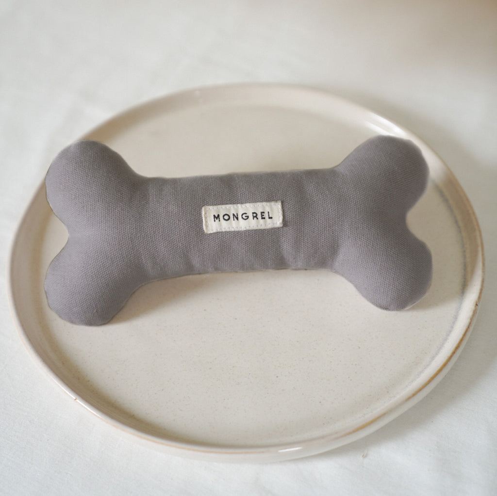 Mongrel's hardwearing, eco-friendly dog bone toy in colour 'coal' as shot by NORD STUDIO